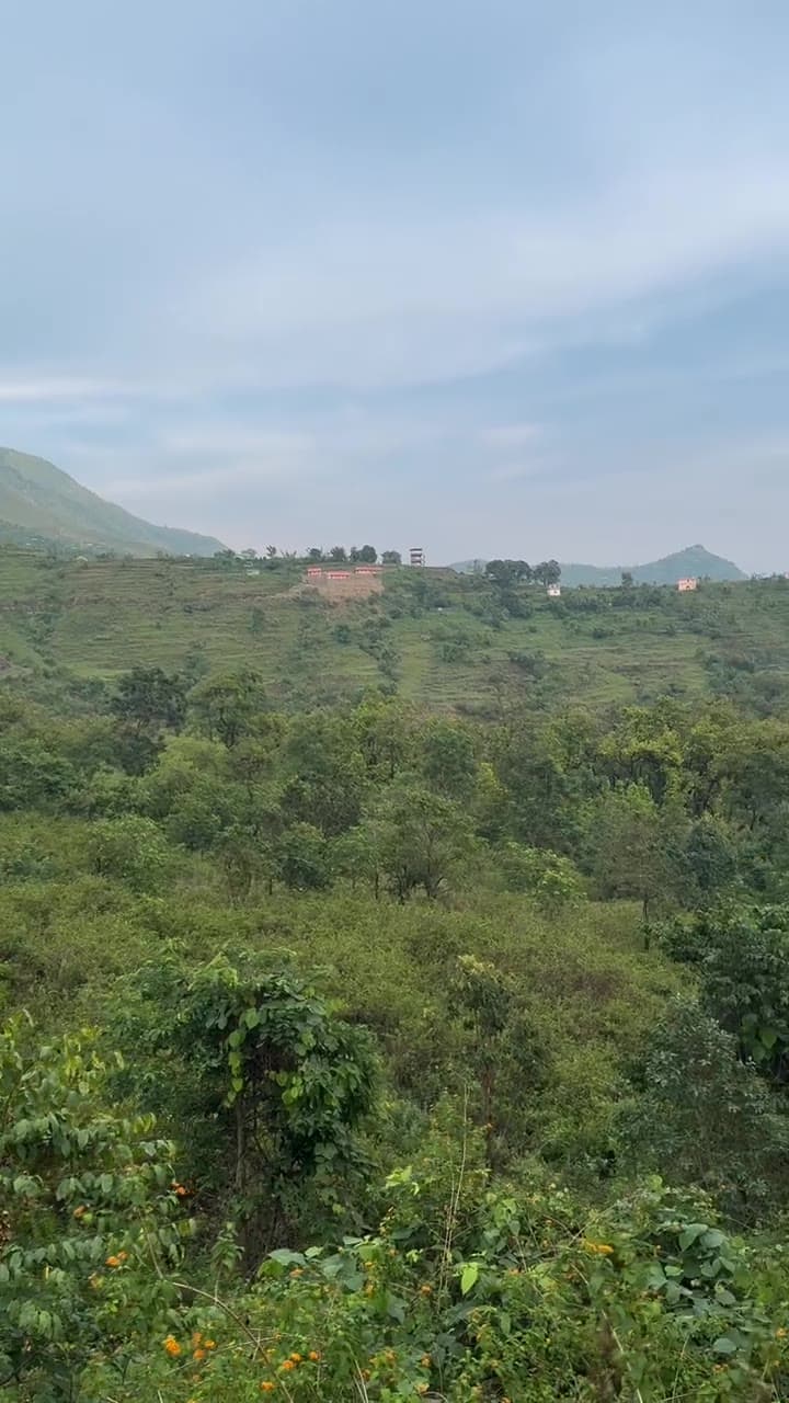 The actual Ekant Villas site amidst rolling forested hills